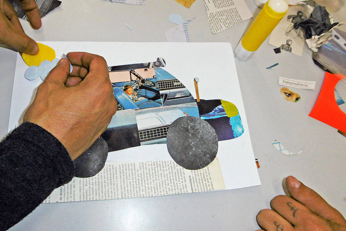 Hands at work on a collage piece. Hands at work on a collage piece.