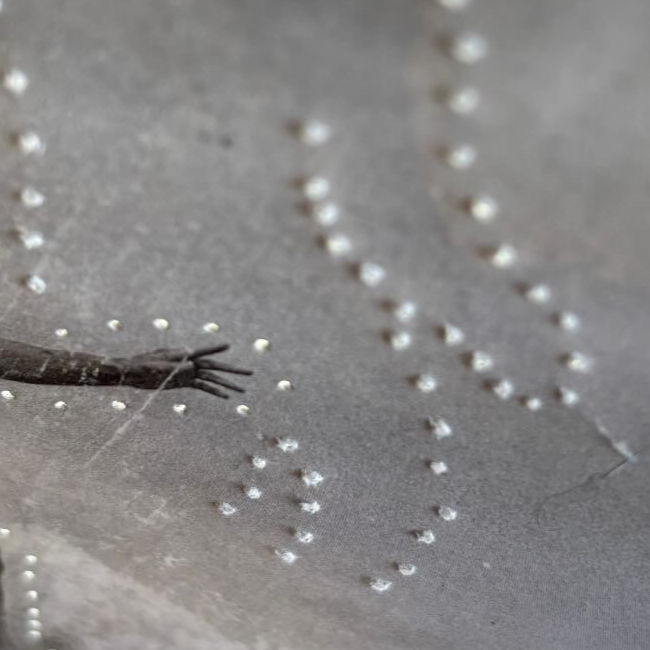 Artistic detail highlighting collage elements and natural shadow play. Artistic detail highlighting collage elements and natural shadow play.