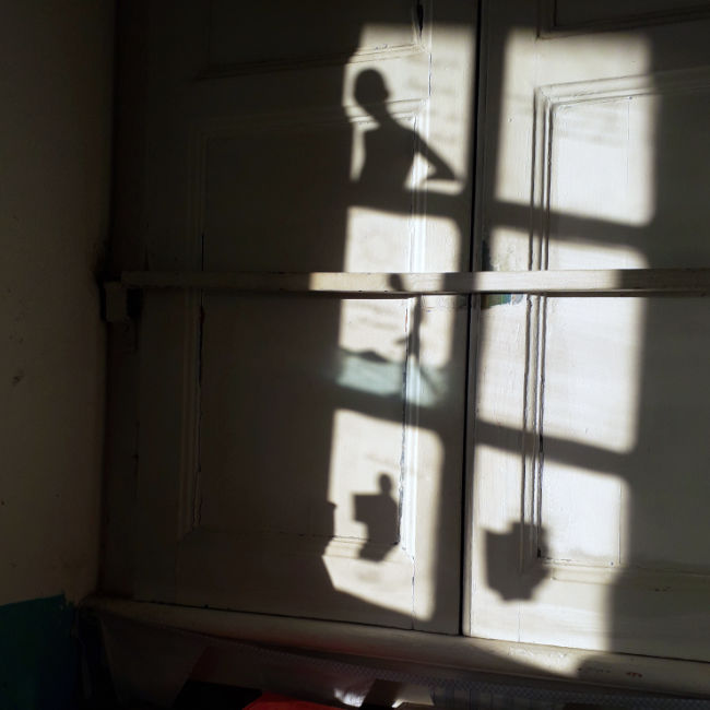 Close-up of collage reflections captured on the atelier window. Close-up of collage reflections captured on the atelier window.