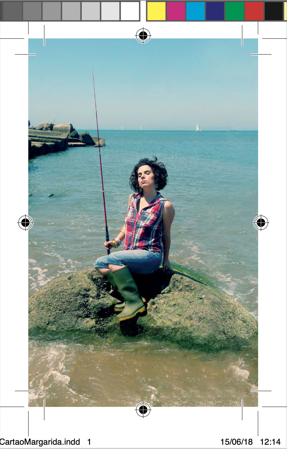 Portrait posing in front of the ‘Fish My Work’ business card, playful and bold.